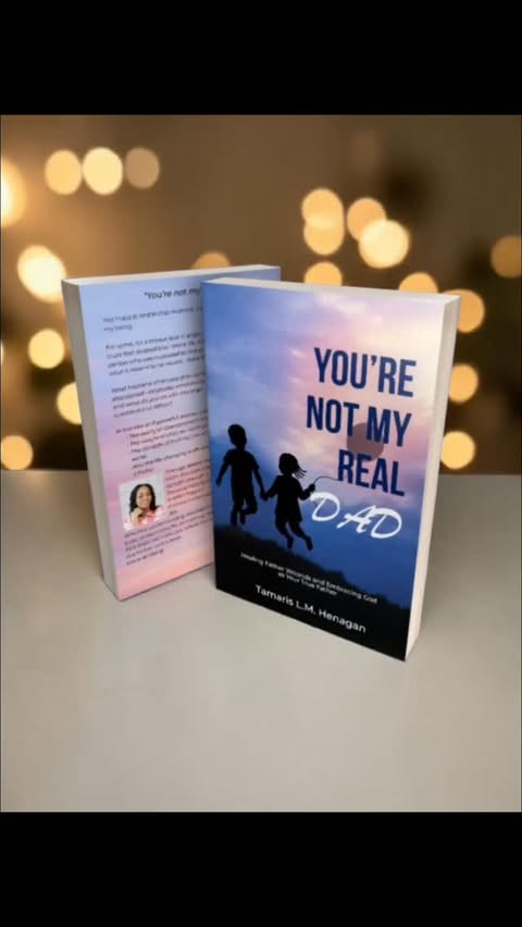 You're Not My Real Dad book with twinkling bokeh lights